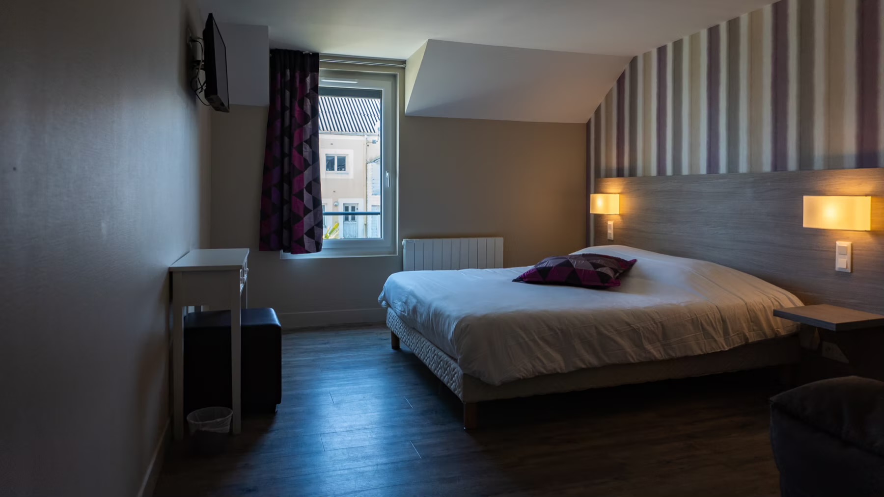 Chambre paisible de l’Hôtel Vauban côté jardin